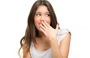 lady suffering from halitosis and bad breath